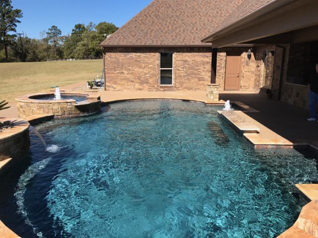 Freeform Pool with Tanning Ledge, Swim-up Bar, Sheer Descent, Bubblers and Raised Spa